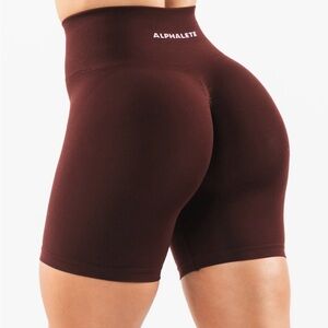Alphalete Sangria colored Amplify Shorts with Wide Waistband and Smooth Texture